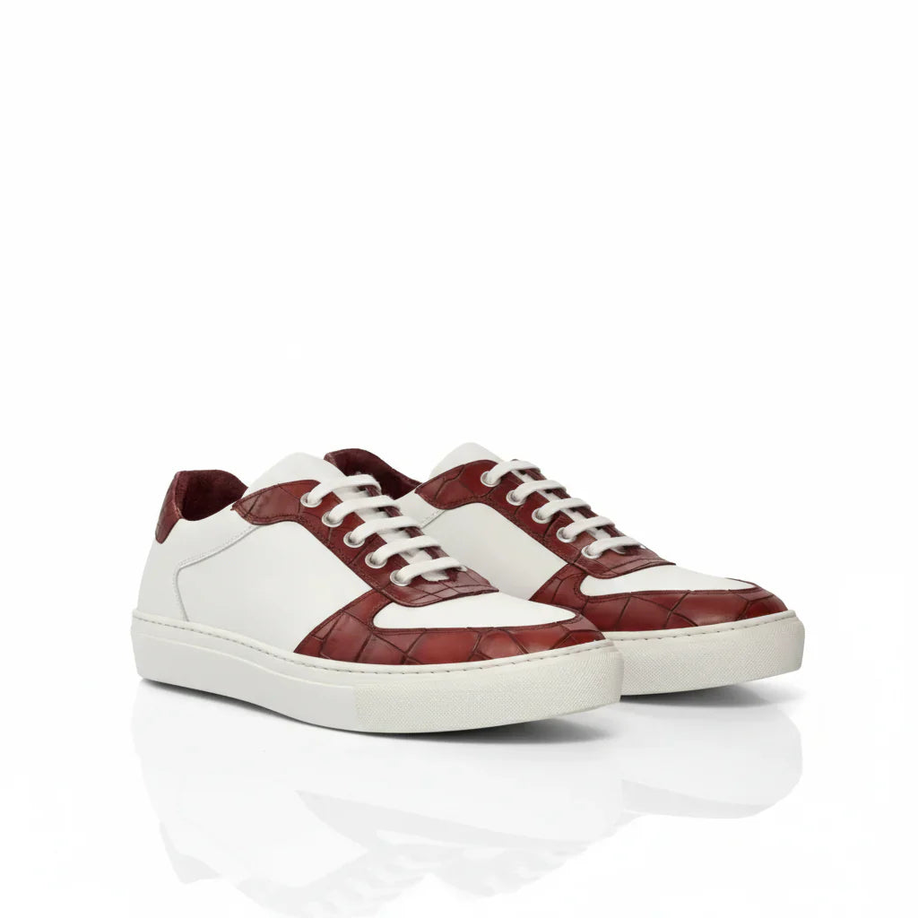 White and burgundy leather sneakers with a woven texture on the toe cap and heel, featuring white laces and a clean, minimalist design.