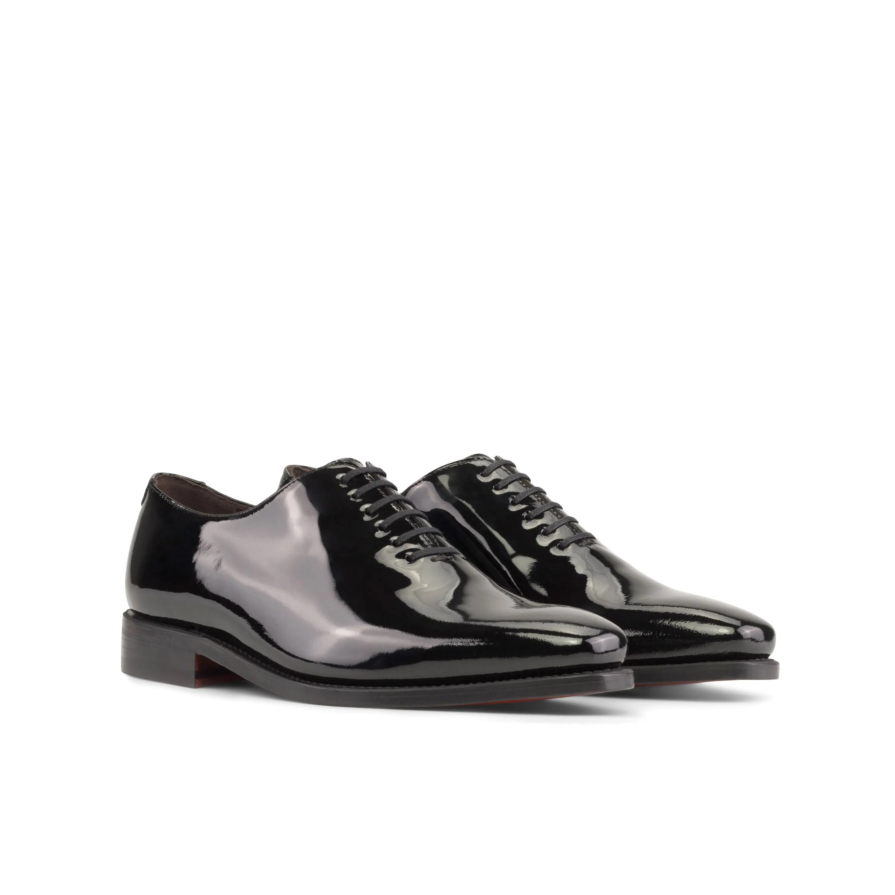 Pair of shiny black Agent2 Wholecut shoes