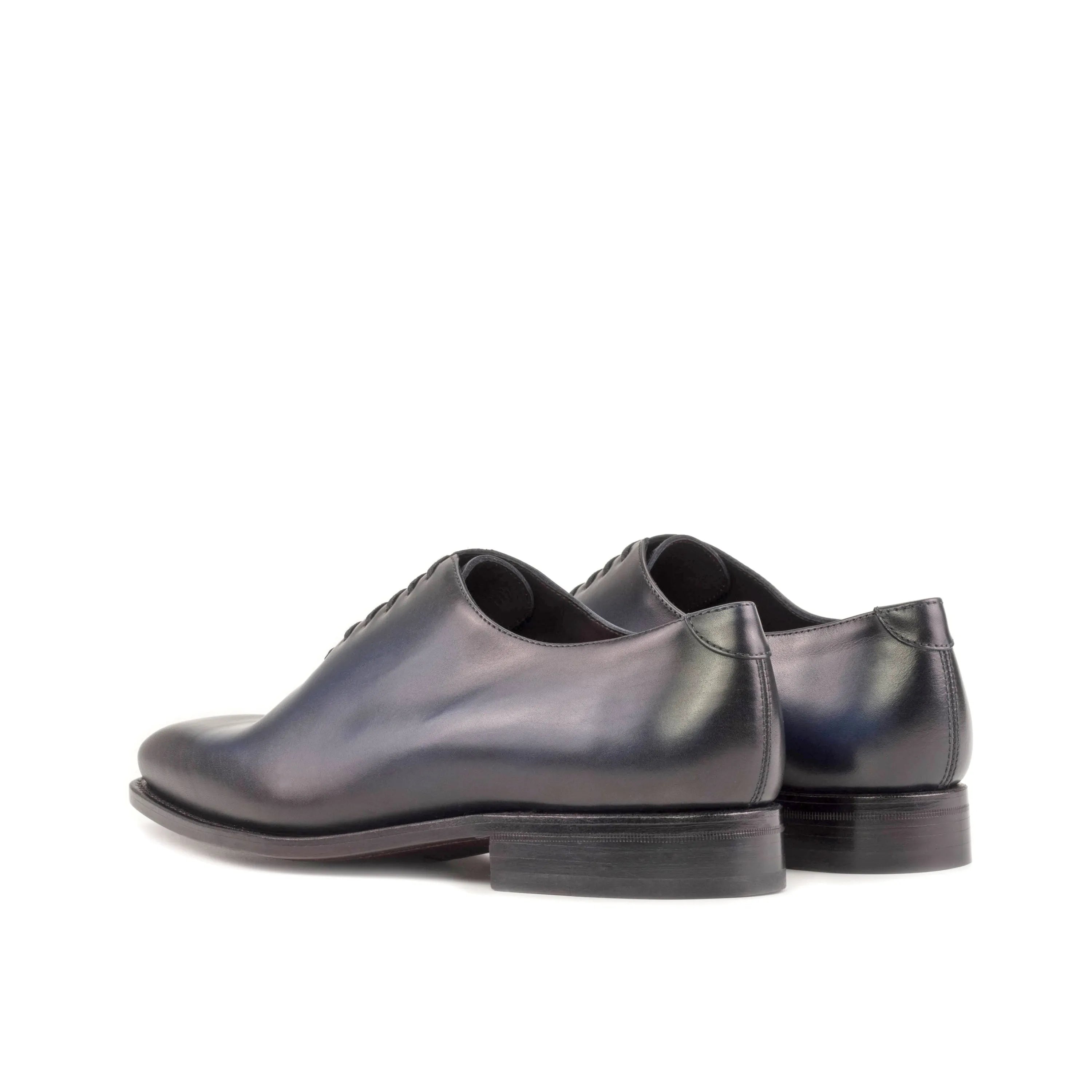 Baron wholecut shoes: pair of dark leather dress shoes