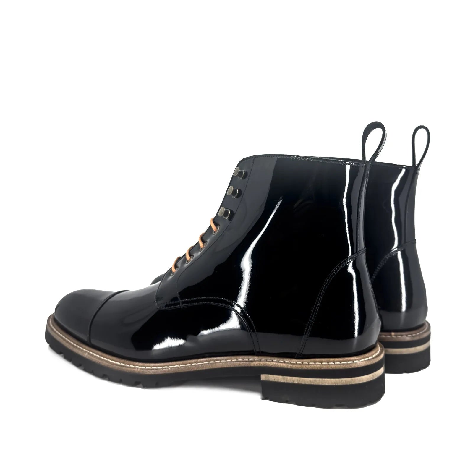 Bossy unisex captoe boots pair of shiny black leather