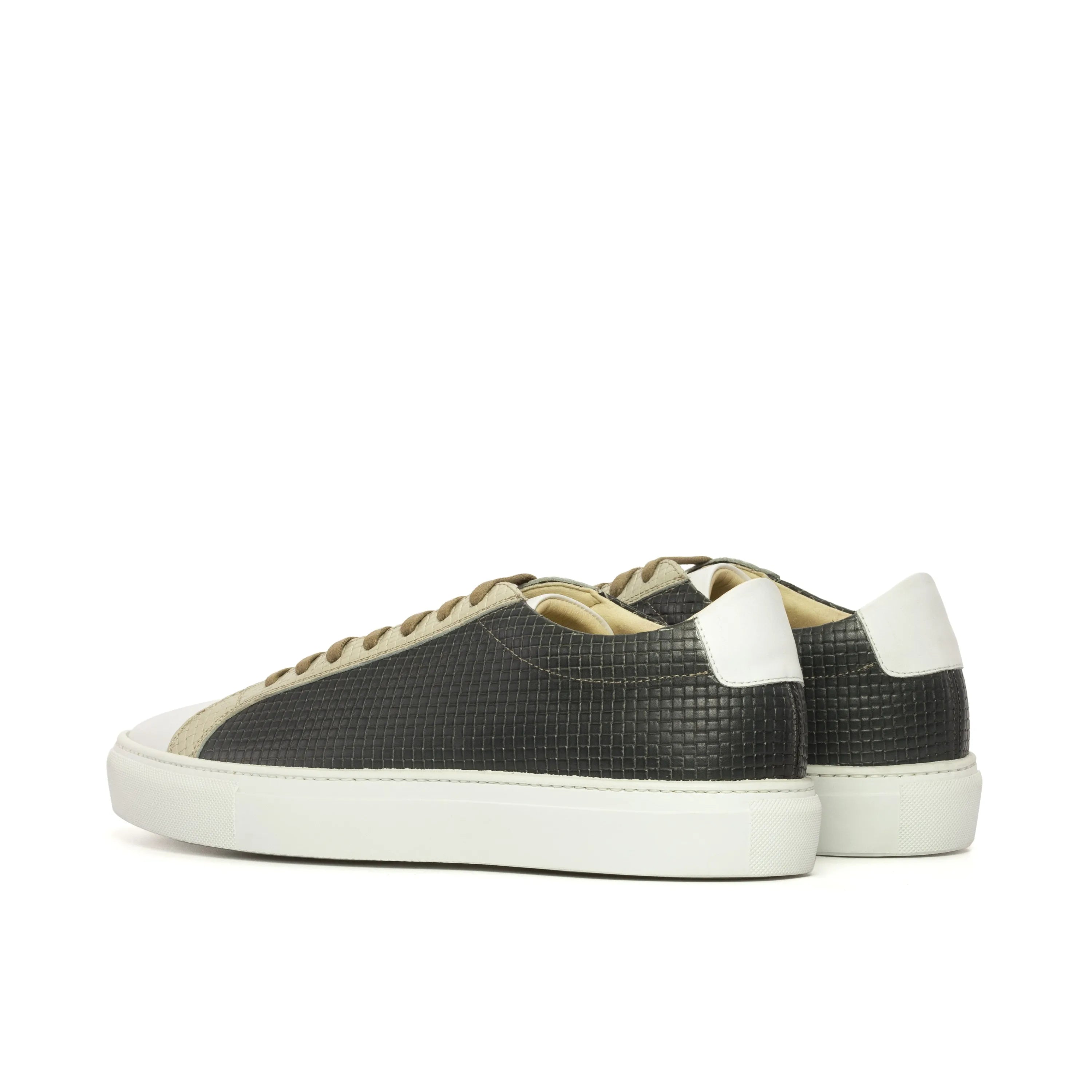 Pair of textured black Cloudy low kick sneakers in braided leather