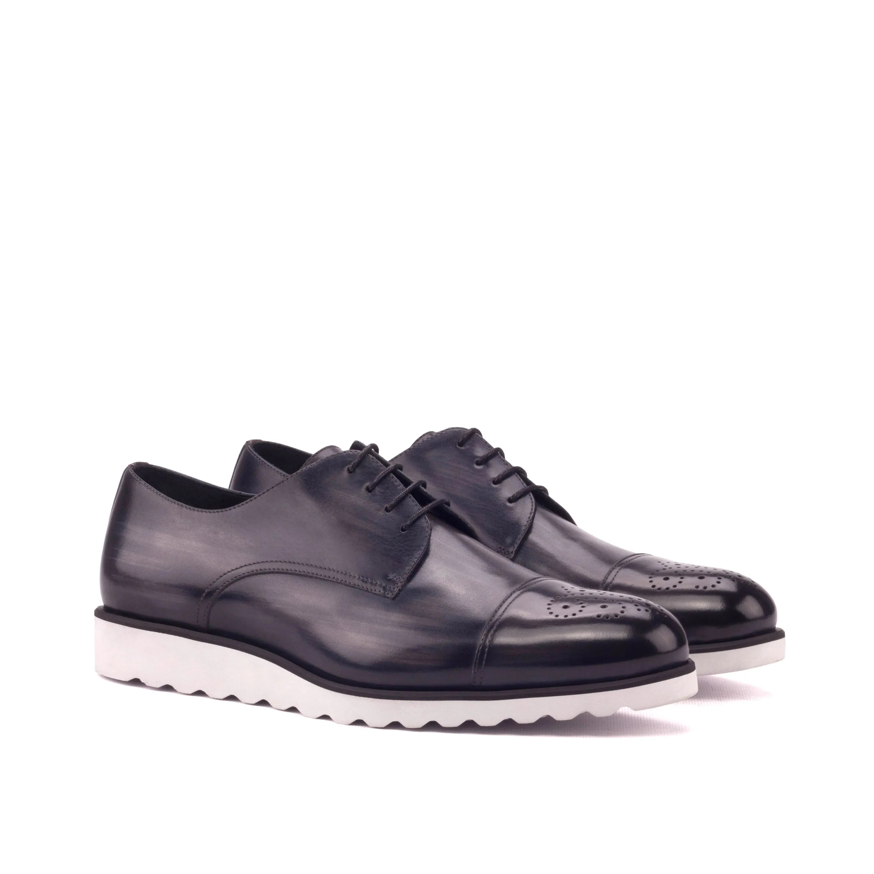 Griffith patina derby shoes: pair of black leather with white soles