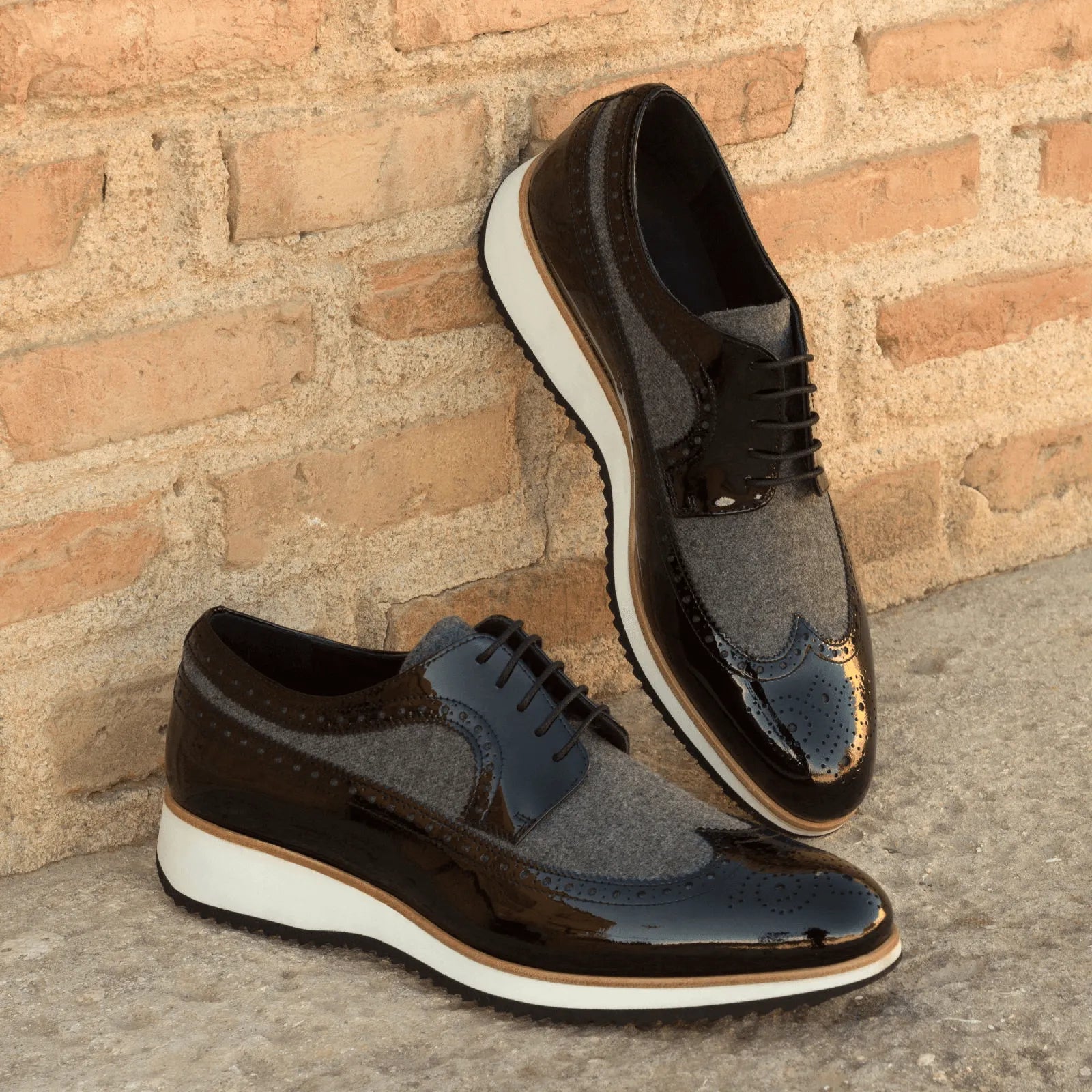 Two-tone black and gray J Milton longwing blucher wingtip shoes
