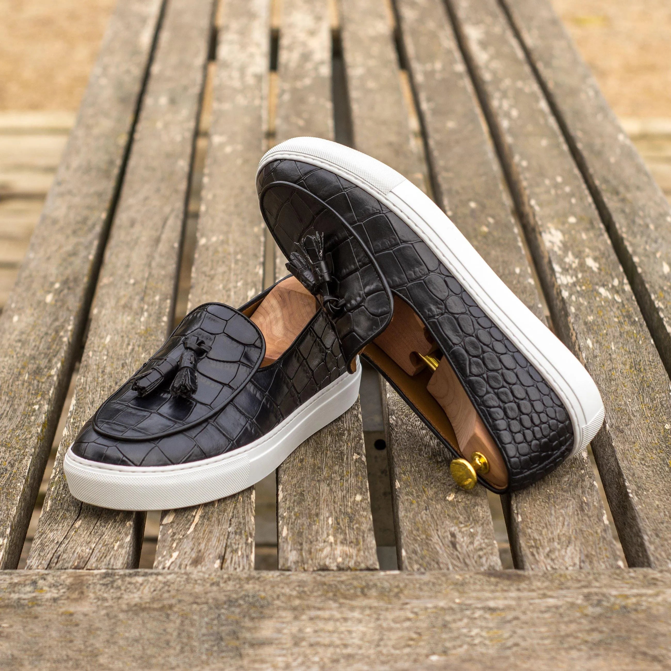 Xevia Belgian monk sneaker with black crocodile-patterned tassel loafers