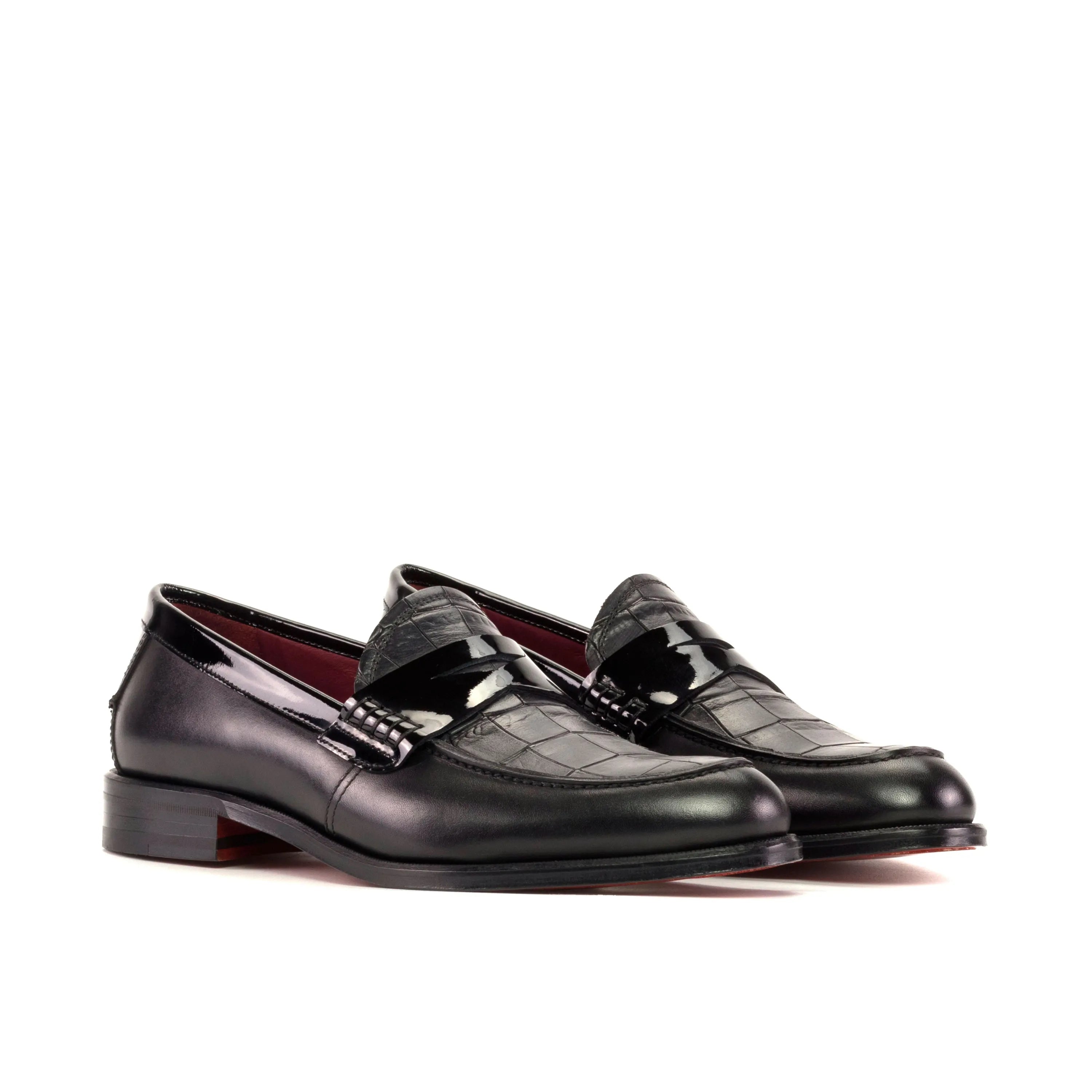 Pair of black leather XO unisex loafers