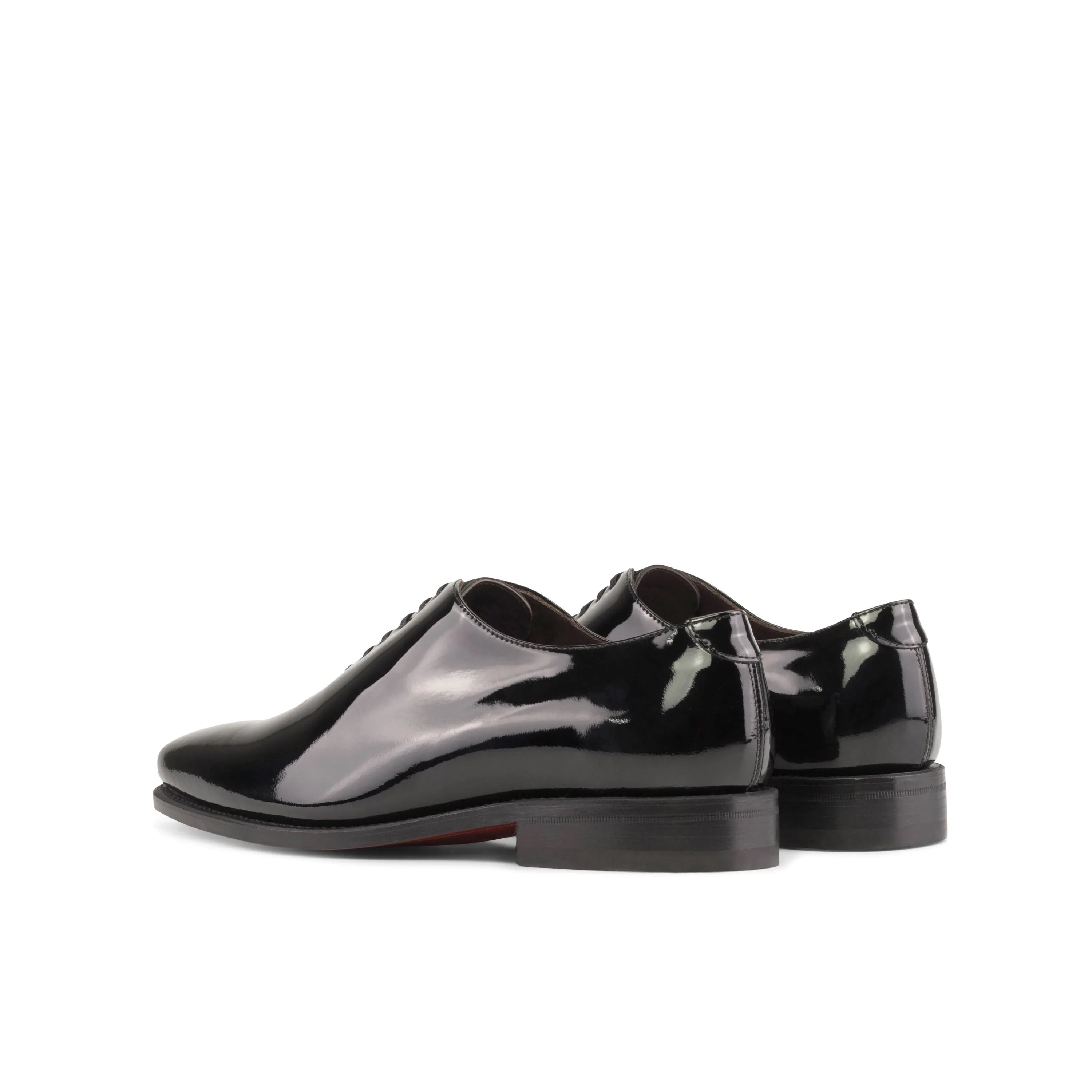 Shiny black Agent2 wholecut shoes pair, rear view