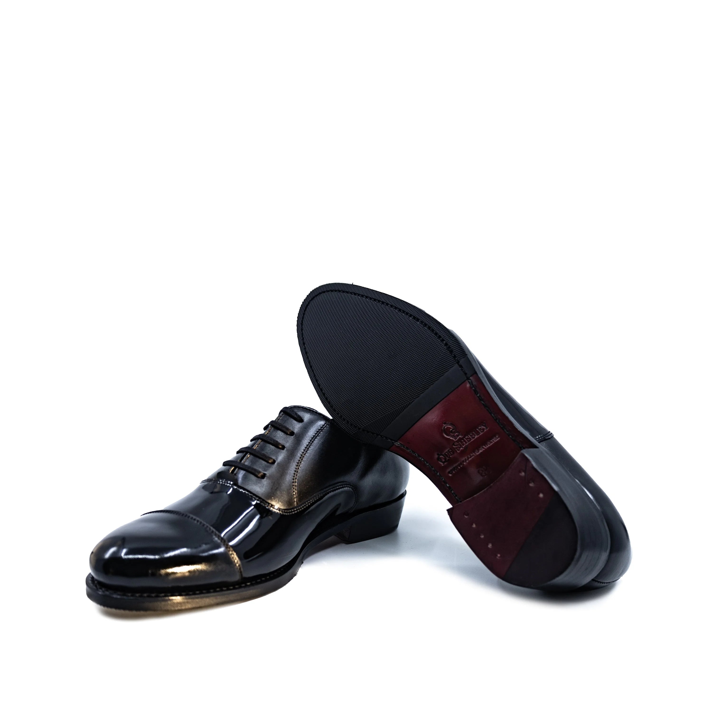 Beyondz Oxford Shoes: black patent leather wingtip with gold accents