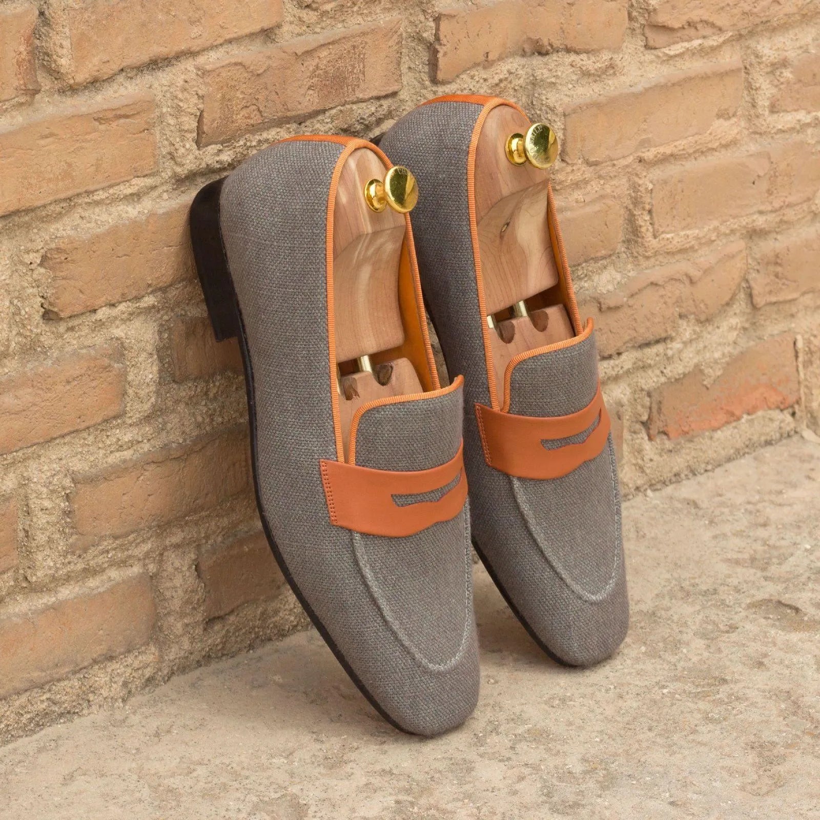 Gray and orange Delight Drake Slipon II penny loafers with shoe trees