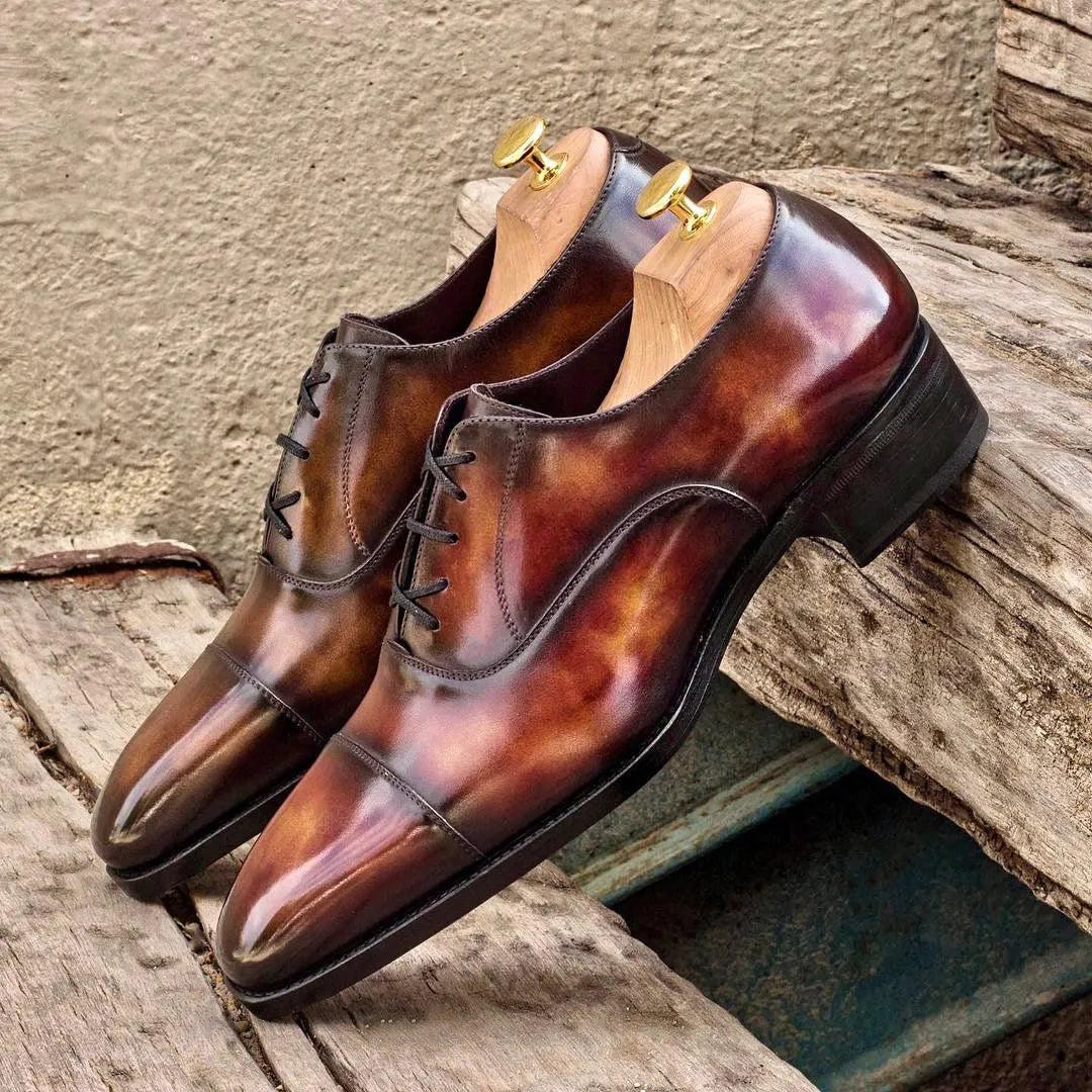 Doublagent oxford patina shoes: pair of brown leather dress shoes