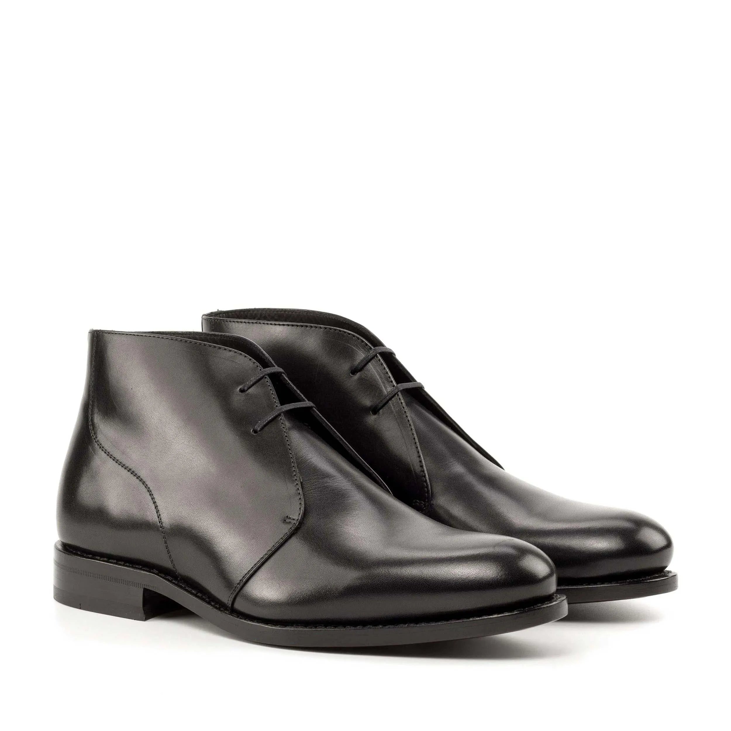 Pair of black leather Filmar Chukka boots in fast lane style