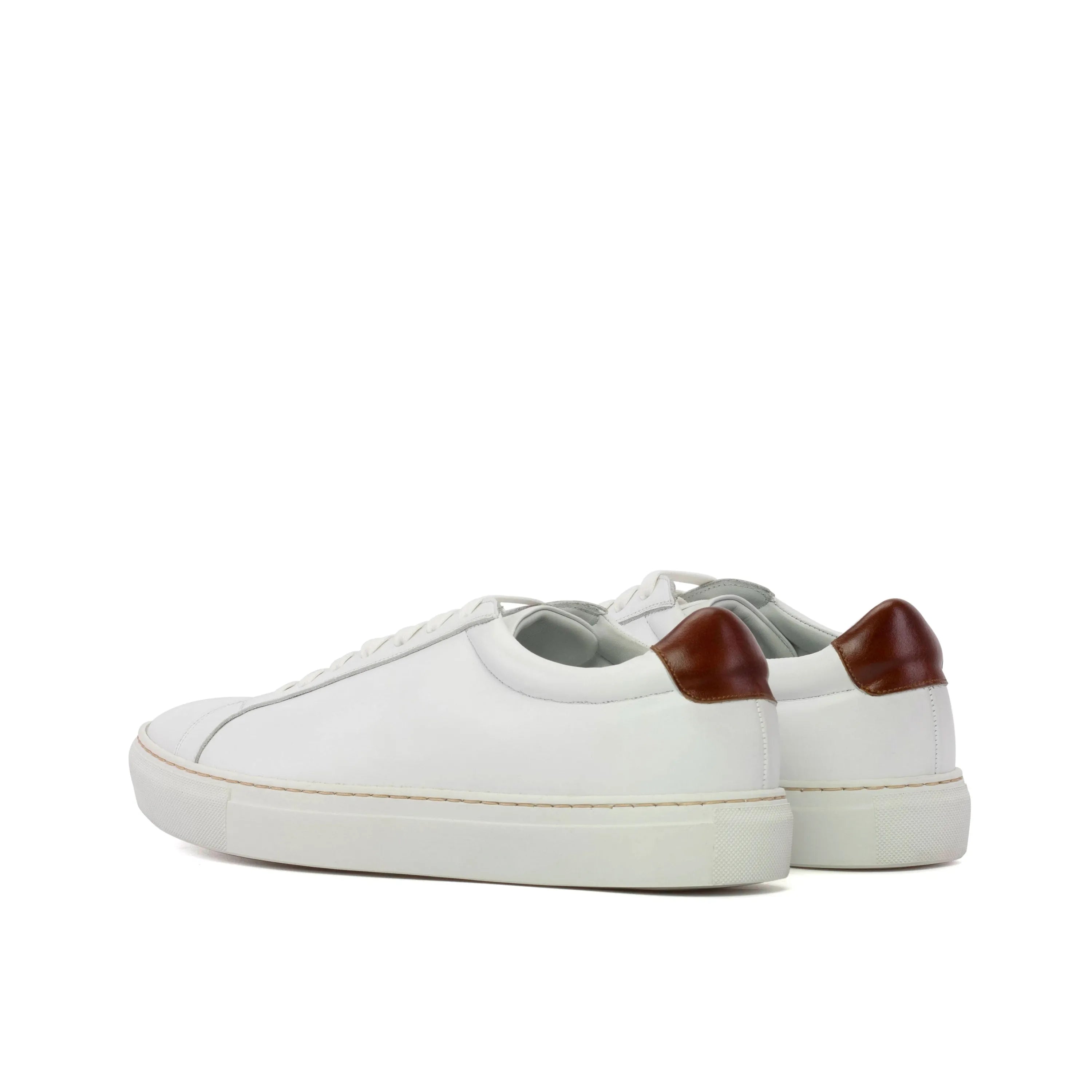 Back view of Garry V2 low kick sneaker in white calf leather with brown heel