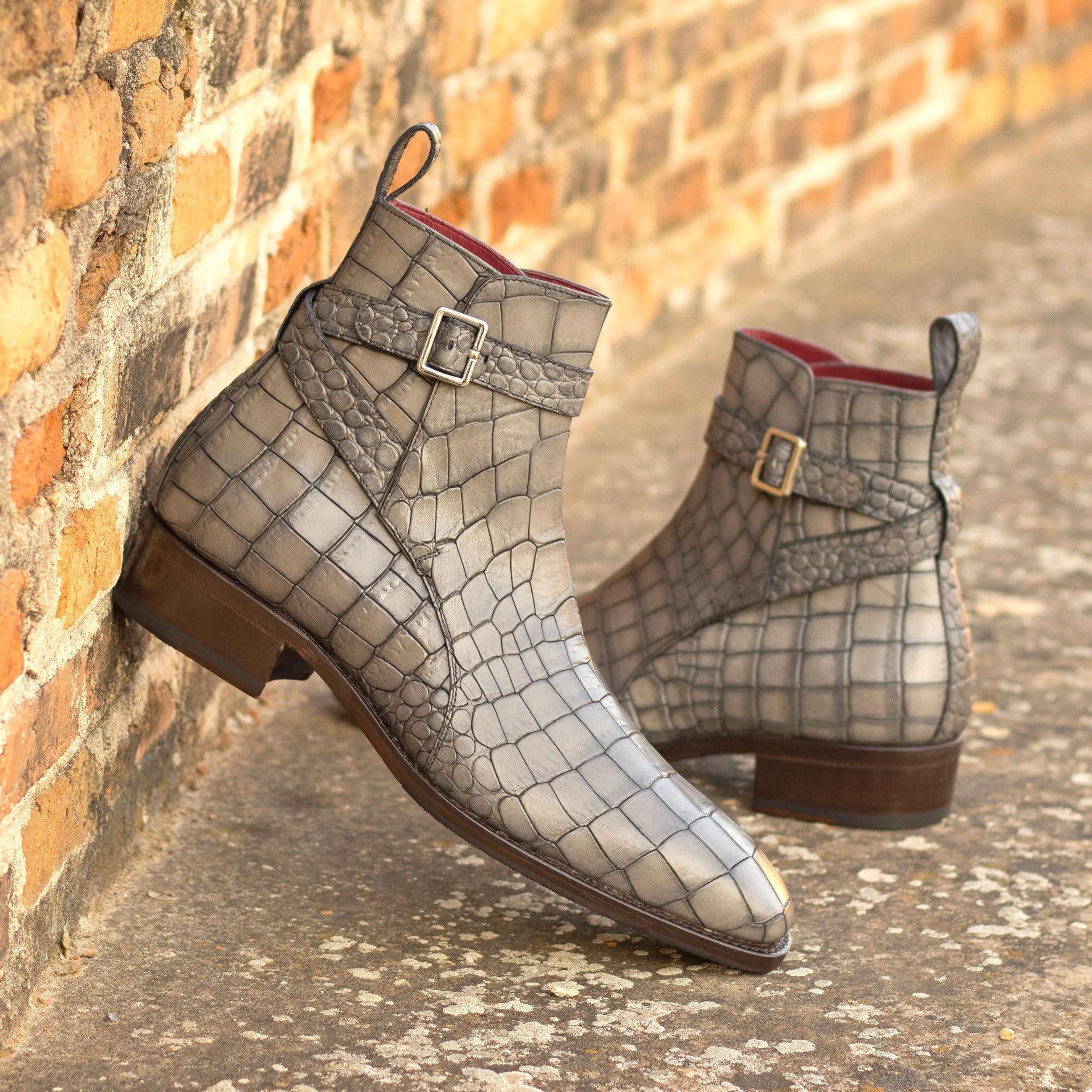 Gray Kain Jodhpur boots in crocodile-patterned ankle design