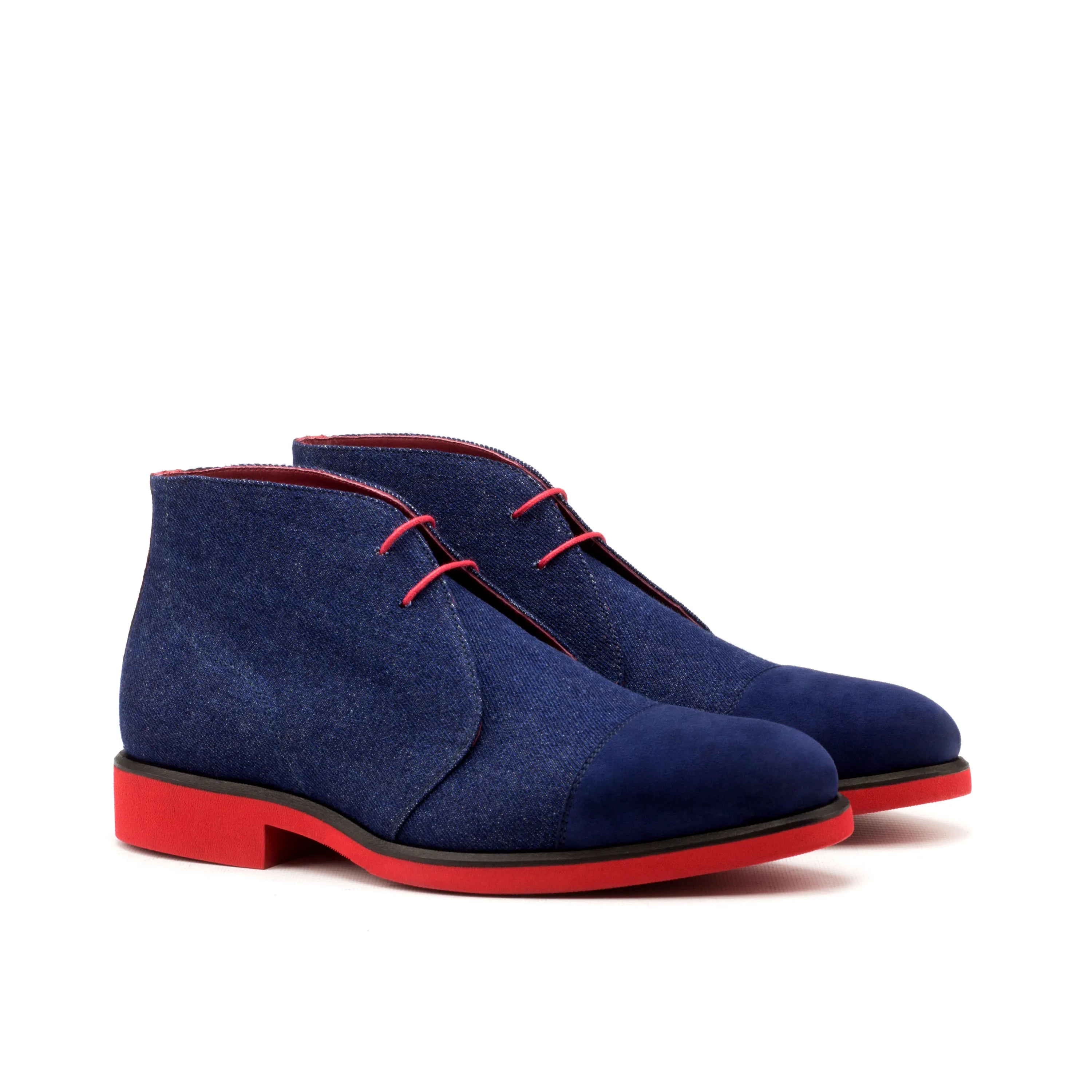 Narek chukkas: blue suede chukka boots with red soles