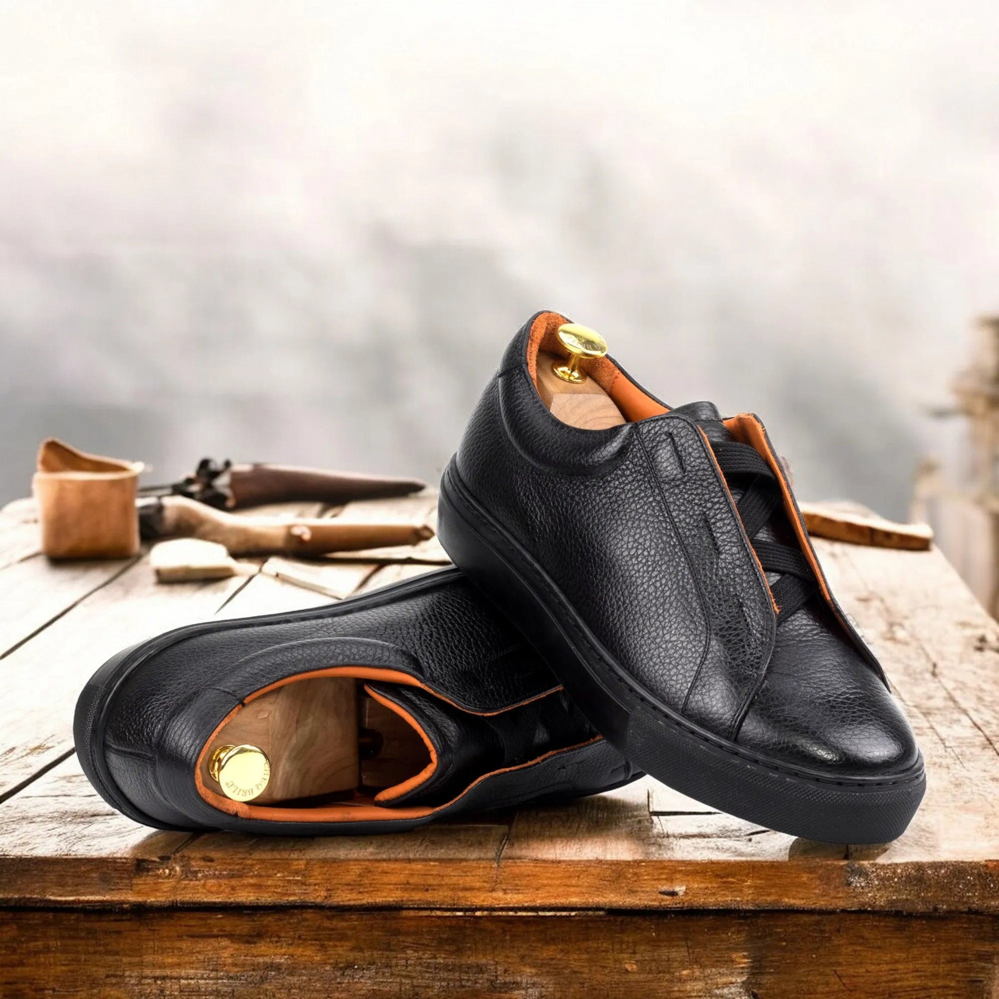 Pair of black leather Ordogan laceless sneakers back view