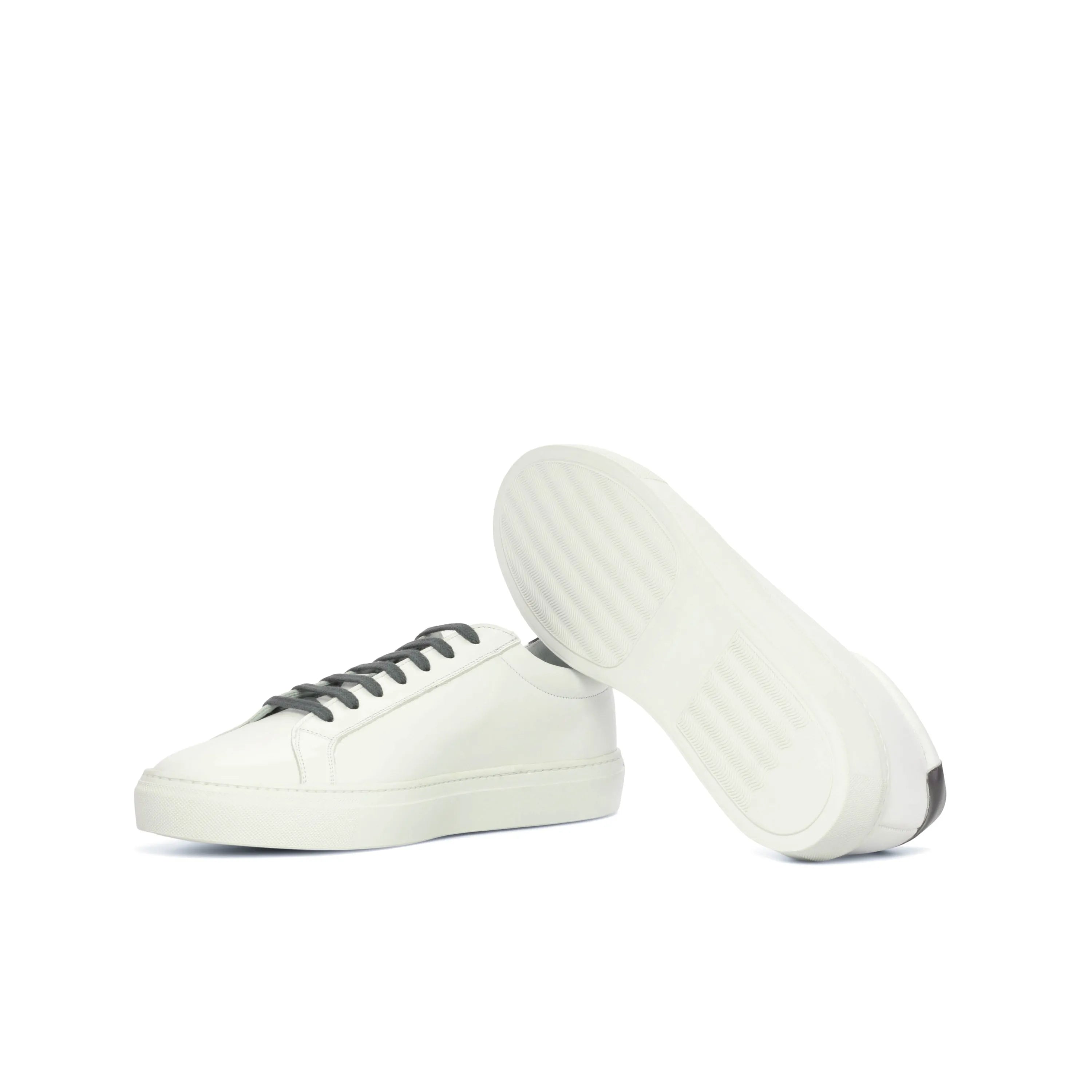Pauli low kick sneaker: white leather with dark laces