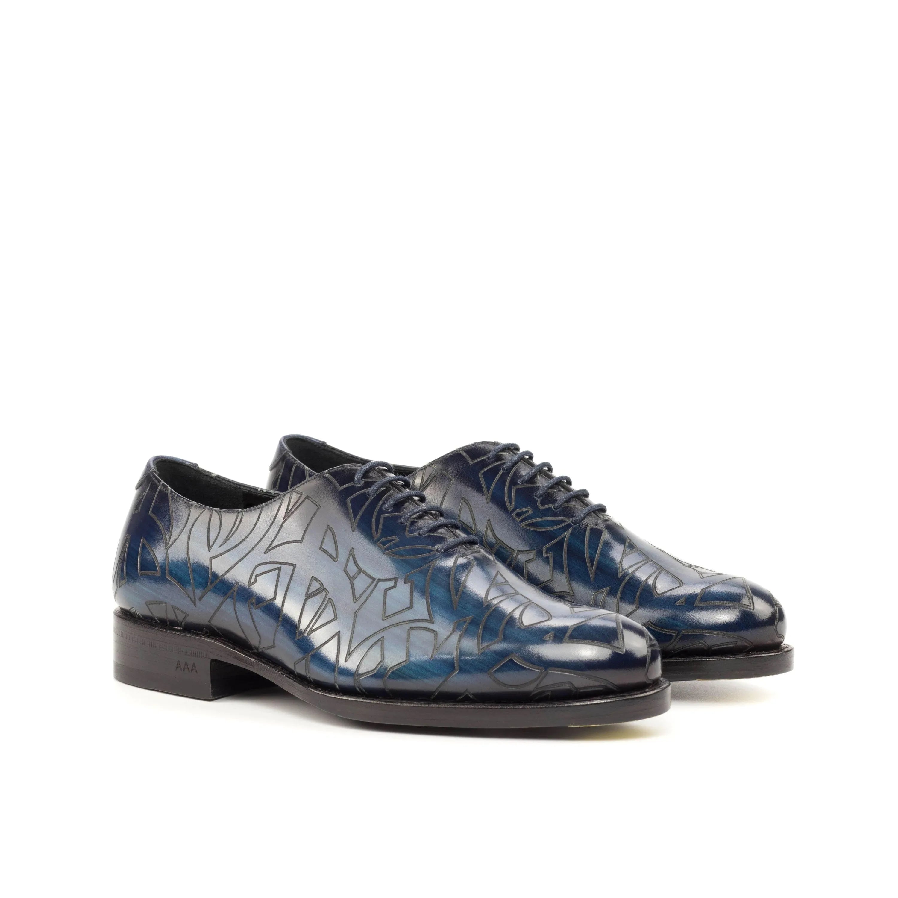 Pair of patterned blue patina wholecut Quswa 2 shoes