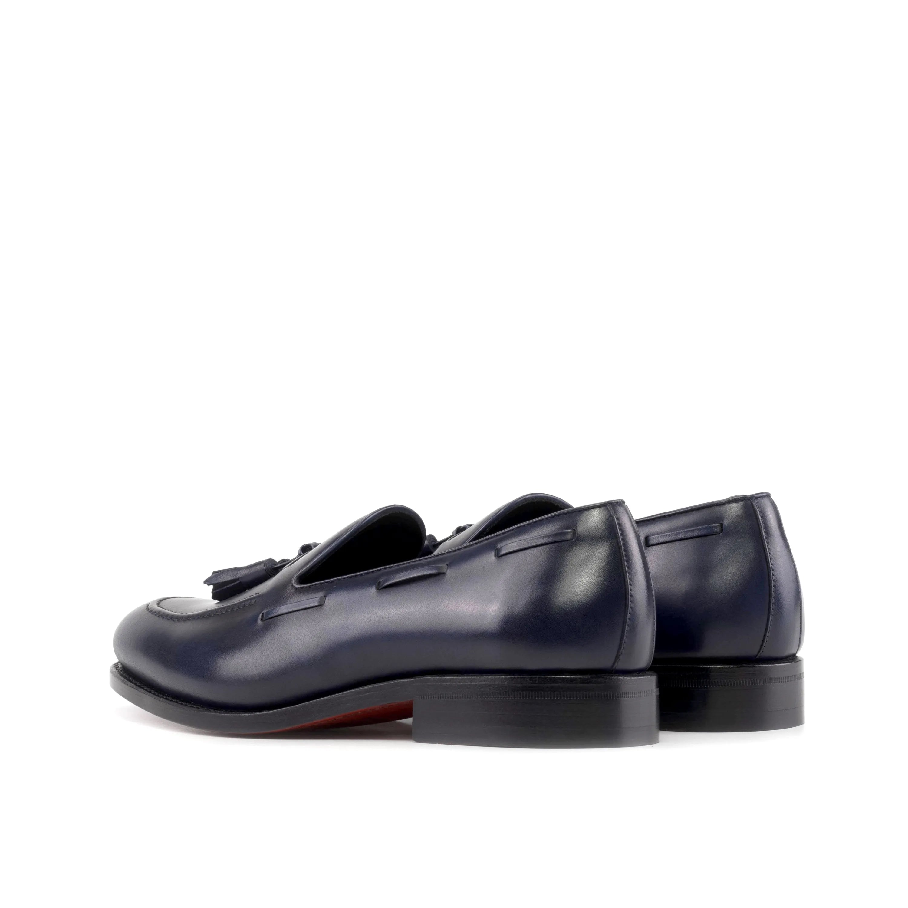 Pair of navy blue leather tassel Sable Loafers, back view. Ships fast lane in 2-3 business days
